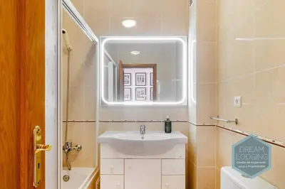 a bathroom with a sink and a mirror at O Mar - Dream Lodging in Olhos de Água
