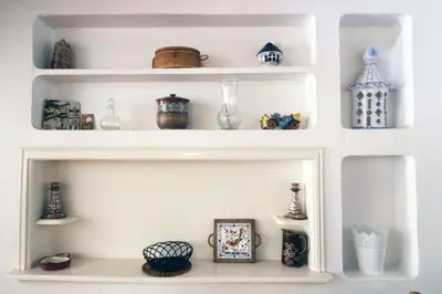 a white shelf with vases and other items on it at V2 - Aldeia do Golfe B2 in Quarteira