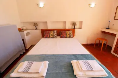 a bedroom with a bed with two towels on it at V2 - Aldeia do Golfe B2 in Quarteira