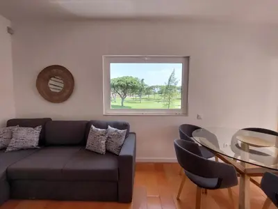 a living room with a couch and a glass table at V2 - Bungalow 12 in Quarteira