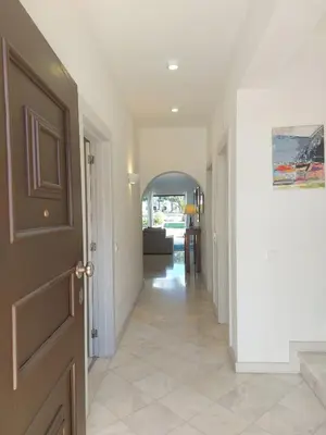 a hallway of a home with a door at Vilamouratenis Duck by SAPvillas in Vilamoura