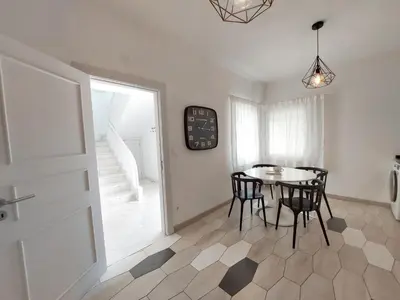 a dining room with a table and chairs at Vilamouratenis Duck by SAPvillas in Vilamoura