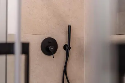 a wall with a black switch on a wall at Terra Alba in Olhos de Água