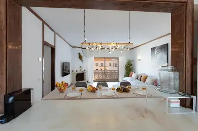 a living room with a couch and a table at Beachtime - Oura Beach Apartment in Albufeira