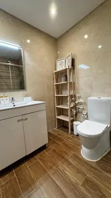 a bathroom with a toilet and a sink at Tenis, Golf e Mar in Quarteira