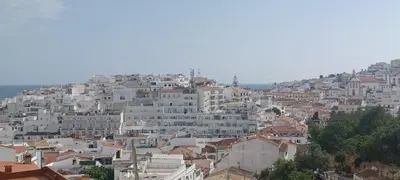 a group of white buildings on a hill at Apart SEA and OLD TOWN VIEWS in Albufeira