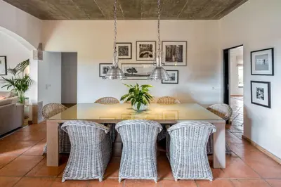 a dining room with a table and chairs at Villa Zambujal in Boliqueime
