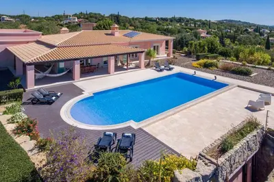 an aerial view of a house with a swimming pool at Villa Mujeira in Loulé
