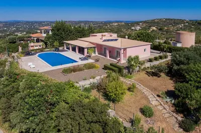 an aerial view of a house with a swimming pool at Villa Mujeira in Loulé