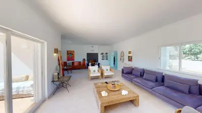 a living room with a purple couch and a table at Villa Sunset,sleeps 9,heatable pool,walk to marina in Vilamoura