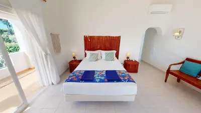 a bedroom with a large bed and a window at Villa Sunset,sleeps 9,heatable pool,walk to marina in Vilamoura