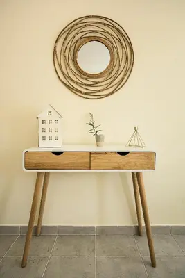 a wooden table with a mirror on a wall at Villa Sunset,sleeps 9,heatable pool,walk to marina in Vilamoura
