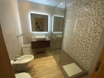 a bathroom with a glass shower and a sink at Luxury ground-floor appartment 5 stars, 2 bedrooms, 2 bathrooms, Free Wifi in Albufeira