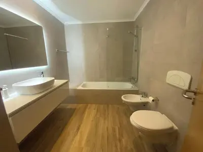 a bathroom with a toilet and a sink and a tub at Luxury ground-floor appartment 5 stars, 2 bedrooms, 2 bathrooms, Free Wifi in Albufeira