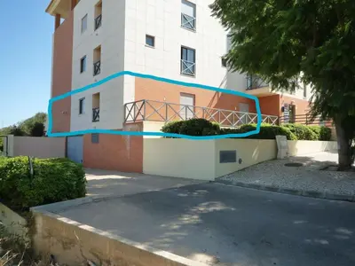 a building with a blue stripe on the side of it at Luxury ground-floor appartment 5 stars, 2 bedrooms, 2 bathrooms, Free Wifi in Albufeira