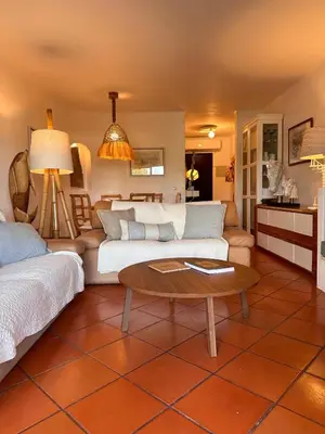 a living room with a couch and a table at Amazing T3 -Clube Albufeira in Albufeira