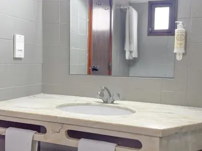a bathroom with a sink and a mirror at Aura Village - City Beach Apartments in Albufeira