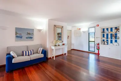 a living room with a couch and a table at Pearl Harbor 3 BDR Flat VLM Marina by LovelyStay in Quarteira
