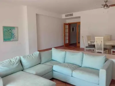 two beds in a room with two lamps on night stands at Vilamoura townhouse in private gated condominium in Quarteira