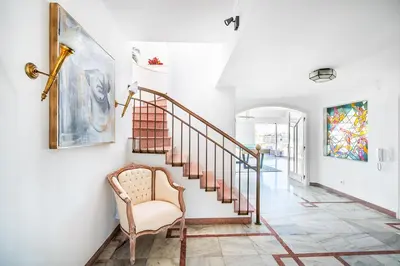 two beds in a white room with a window at Luxe Penthouse, BBQ, hot spa, games, ocean view - By Seareen in Albufeira