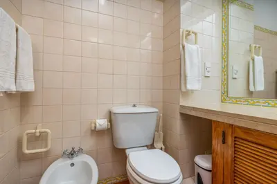 a bathroom with a toilet and a sink at Pool Apartment Vilamoura near Old Village in Quarteira
