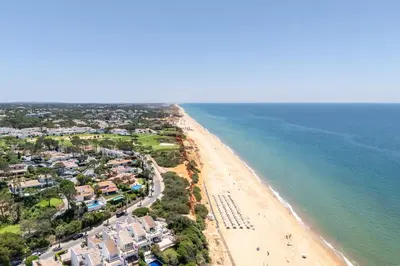 an aerial view of a beach and the ocean at Casa Aurora in Vale do Lobo