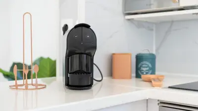 a black appliance sitting on top of a kitchen counter at Vivenda Neves in Albufeira by LovelyStay in Vale de Pedras