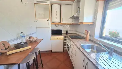 a kitchen with a sink and a counter top at albufeira sweety house in Albufeira