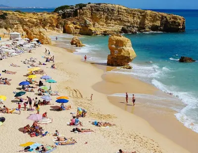 a group of people on a beach in a cave at LizHolidays in Albufeira