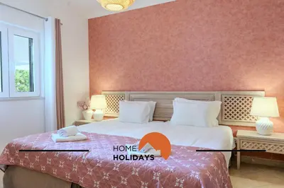 a bedroom with a bed with a have holidays sign on it at #322 Albufeira Family Stay by Home Holidays in Albufeira