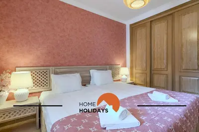 a bedroom with a bed with a home holidays sign on it at #322 Albufeira Family Stay by Home Holidays in Albufeira