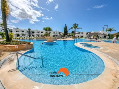 a swimming pool at the hilton tobago resort at #322 Albufeira Family Stay by Home Holidays in Albufeira