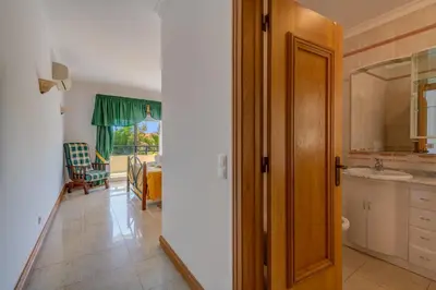 a kitchen with a door leading to a dining room at Apartment Galé Mar By Zimzala & Bedzy in Guia