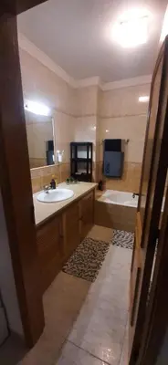 a bathroom with a sink and a bath tub at Villa David in Albufeira