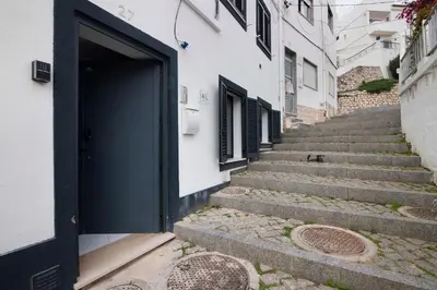 a stairway leading up to a door in a building at Mi Casa Es Su Casa Nº3 in Albufeira