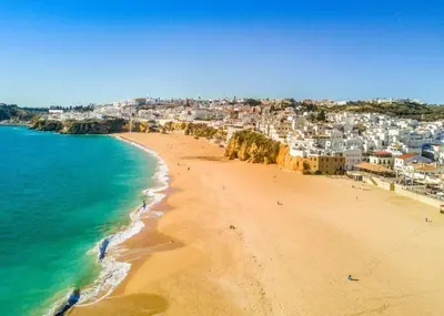 a view of a beach with buildings and the ocean at APT T2 - Marina de Albufeira in Albufeira