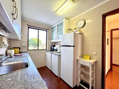 a kitchen with a refrigerator and a sink at Vilamoura Central 12 With Pool by Homing in Vilamoura