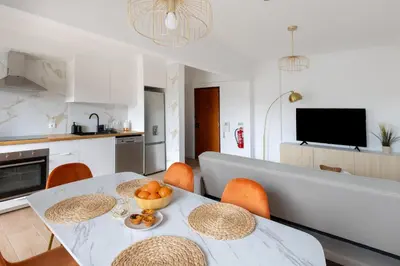 a kitchen and dining room with a table and chairs at Golden Nest - Faro Old Town in Faro