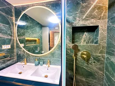 a bathroom with a sink and a mirror at Oura Modern Poolside Condo by BeCherish in Vale de Pedras