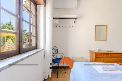 a bedroom with a bed and a window at #240 Beach House - Casa da Balaia by Home Holidays in Olhos de Água