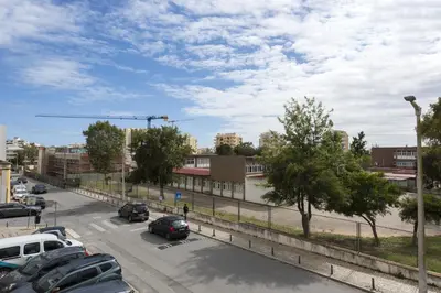 a view of a parking lot with cars parked at Salty - Near the city by HD in Faro
