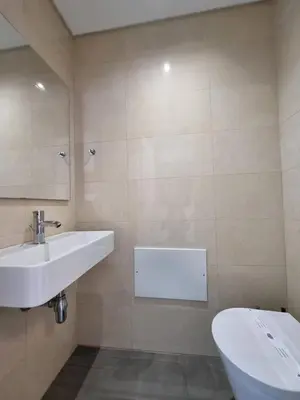 a bathroom with a sink and a toilet at Luxury Design Villa (Private Pool & Jacuzzi) in Albufeira