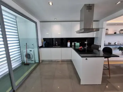 a white kitchen with a sink and a stove at Luxury Design Villa (Private Pool & Jacuzzi) in Albufeira