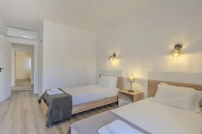 a living room with a couch and a table at #022 T2 Velamar by Home Holidays in Albufeira