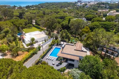 an aerial view of a house with a swimming pool at Balaia Retreat - Nature & Beach in Olhos de Água