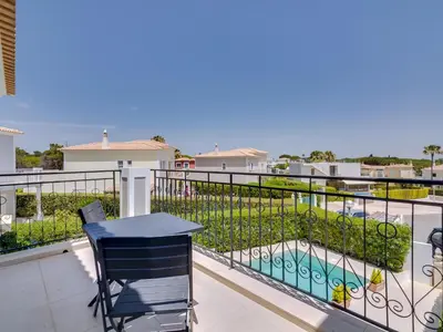 a bathroom with two sinks and a shower and a tub at Casa Barakat with Pool and BBQ in Vale do Lobo in Quinta do Lago
