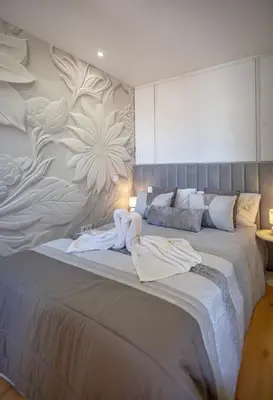 a bedroom with a large bed with towels on it at NEW! Dream Terrace Albufeira Ocean and Pool Views in Bicas