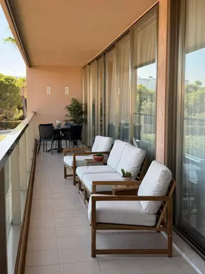 a balcony with several couches and a table on it at Herdade dos Salgados in Guia