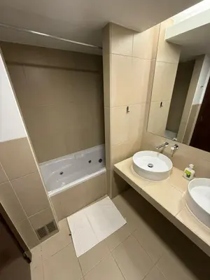 a bathroom with a sink and a toilet and a tub at Herdade dos Salgados in Guia