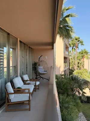 a balcony with couches and chairs on a building at Herdade dos Salgados in Guia
